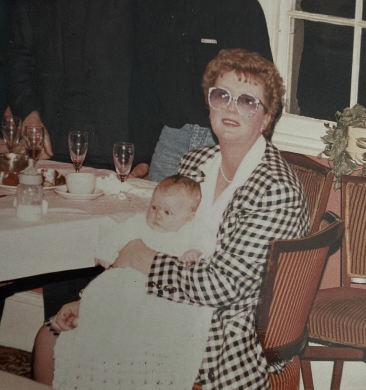 Ava holding baby Melissa at her christening