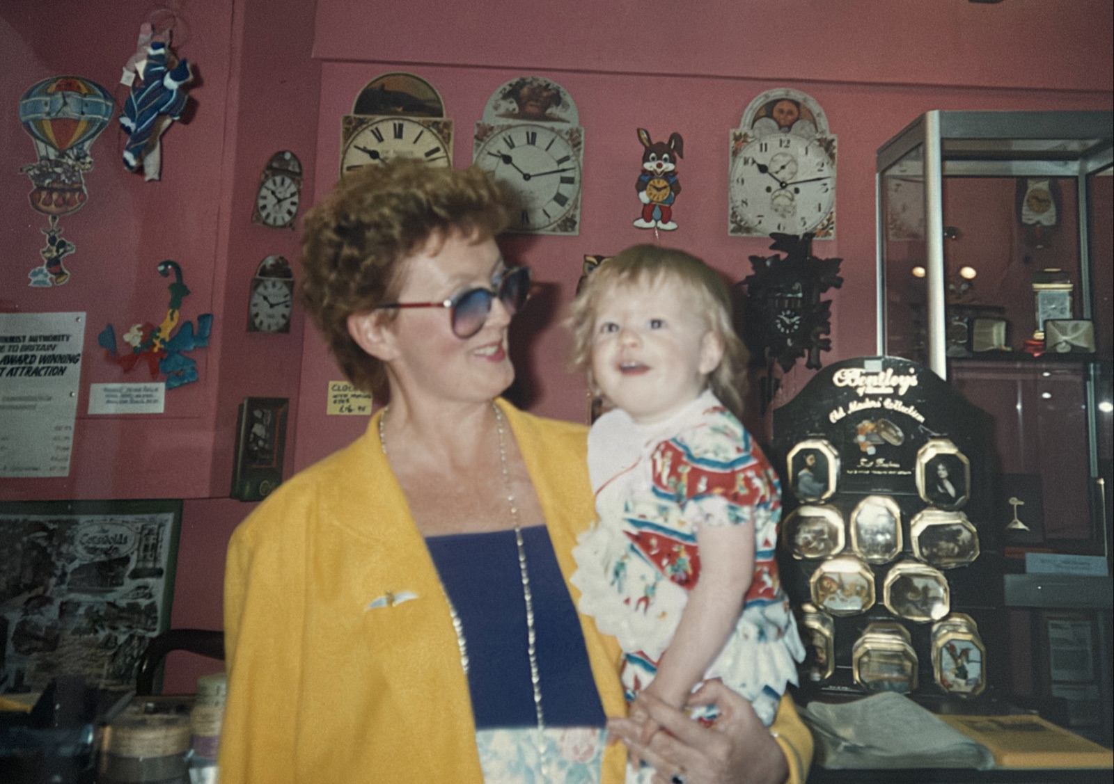 Ava holding young Melissa at the clock museum
